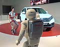 ASIMO and the personal mobility device the U3-X on stage together in Europe for the first time