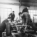 Alpine pit garage Jean REDELE, Alpine founder, with mechanics around a single-seater