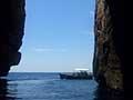 Vista interna della grotte a S.Maria di Leuca con barca turistica