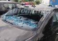Auto bersagliata dalla grandine con bozzi sul cofano e vetro rotto nei pressi del Centro Commerciale di Casammassima, Bari
