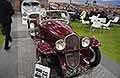 Fiat Balilla 508 S Coppa d�Oro del 1935 vintage car sullo sfonto la Cisitalia 202 SC berlinetta in bella mostra ad Auto e Moto d�Epoca 2025 presso Bologna Fiere. Scopri la Fiat 508 S Coppa d�Oro macchina d�epoca. Guarda le Foto esclusive di Automania!