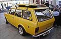 Fiat 127 station wagon del 1971 con tavola da Serf sul portapacchi esposta ad Auto e Moto d�Epoca 2025 presso Bologna Fiere. Scopri l�auto d�epoca Fiat 127 station wagon. Guarda le Foto di Automania!