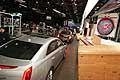Cars driving onto show floor 2014 NAIAS of Detroit