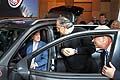 Vice President Joe Biden sits in a Jeep while Sergio Marchionne and Bob Shuman