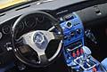 Dettaglio interni tuning volante Isotta e cruscotto centrale blu fosforescente allevento Donne e Motori 2012