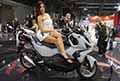 Sym Husky Adv e sexy hostess Francesca Ferigo allEicma di Milano 2021 78^ edizione