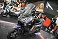 Beautiful hostess Francesca Artifoni e Sym Jetride 300 scooter in mostra allEicma 2021 di Milano presso Fiera Rho