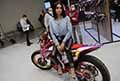 Sexy ragazza in sella alla motocross Honda allEicma 2021 di Milano il Salone Internazionale del Motociclo