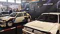 Peugeot 205 Turbo 16 bianco perla e la versione racing cars della Peugeot 205 Turbo sullo sfondo ad Auto e Moto dEpoca di Padova
