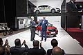 Qoros at the 2014 Geneva Motor Show: Vice Chairman Volker Steinwascher and Executive Director of design Gert Hildebrand celebrate the global debut of the Qoros 3 Hatch