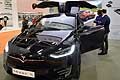 Tesla Model X auto elettrica con apertura porte posteriori ad ali di gabbiano ispirati dalle Mercedes AMG al Motor Show 2016 di Bologna