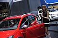 Ragazza che affianca la vettura Volkswagen Cross Up! al Motorshow di Bologna