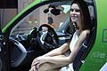 Ragazza sedutta nella Smart EV al Motor Show di Bologna 2011