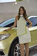 Beautiful hostess near Suzuki S-Cross at the Mondial de lAutomobile in Paris 2012