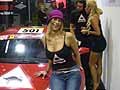 Team e scuderie con supercar Ferrari sponsor Libid Bull e sexy ragazze sorridenti al Motor Show 2009