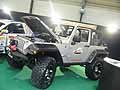 Team e scuderie, accessori e aftermarket per auto. Jeep Wrangler Rubicon con cofano aperto al Salone di Bologna 2009 