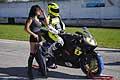 Seconda posizione biker Introna Antonio su moto honda e ragazza ombrellino presso lAutodromo del Levante edizione 2015